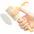 PawLunor Grooming Comb release button being pressed, fur ejected