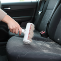 PawLunor Lint Roller being used on car seat covered in dog fur