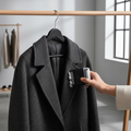 PawLunor Fabric Brush in use on dark wool coat on rack